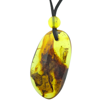 Beautiful pierced Baltic amber pendant with cord
