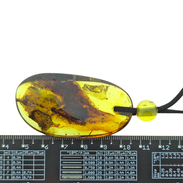 Beautiful pierced Baltic amber pendant with cord