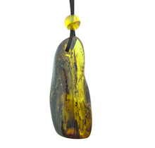 Beautiful pierced Baltic amber pendant with cord