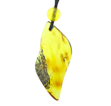 Beautiful pierced Baltic amber pendant with cord