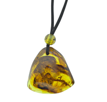 Beautiful pierced Baltic amber pendant with cord