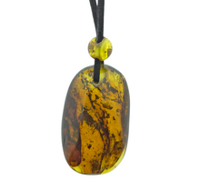 Beautiful pierced Baltic amber pendant with cord
