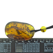 Beautiful pierced Baltic amber pendant with cord