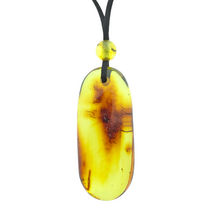 Beautiful pierced Baltic amber pendant with cord