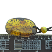 Beautiful pierced Baltic amber pendant with cord