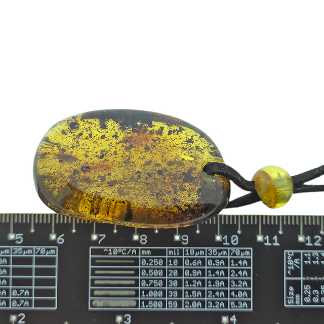 Beautiful pierced Baltic amber pendant with cord