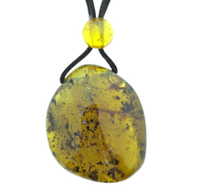 Beautiful pierced Baltic amber pendant with cord