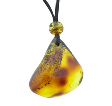 Beautiful pierced Baltic amber pendant with cord