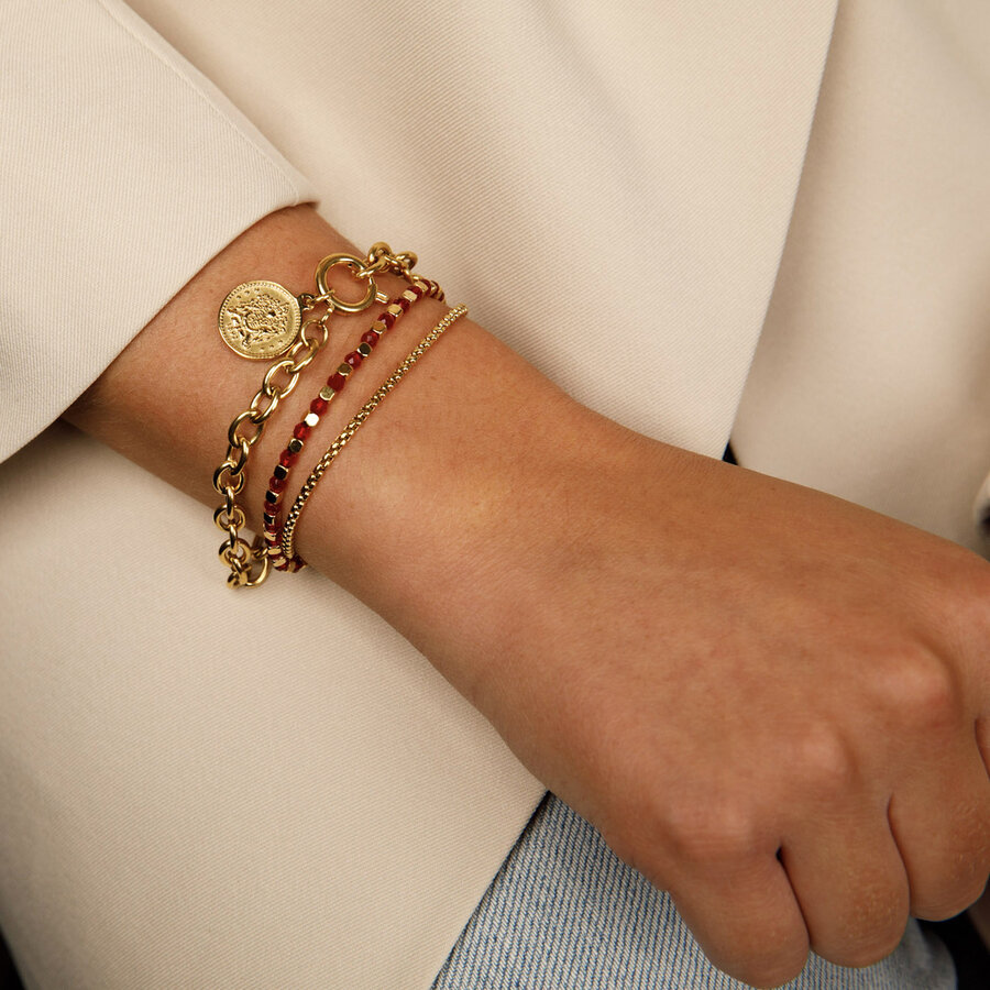 My Bendel Gold double bracelet with red glasstones and links.