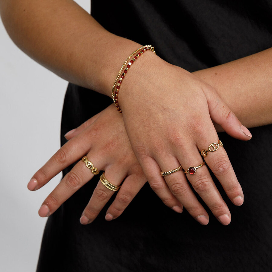 My Bendel Gold double bracelet with red glasstones and links.