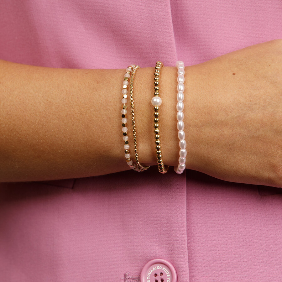 My Bendel Elastisches Goldarmband mit ovalen rosa Perlen