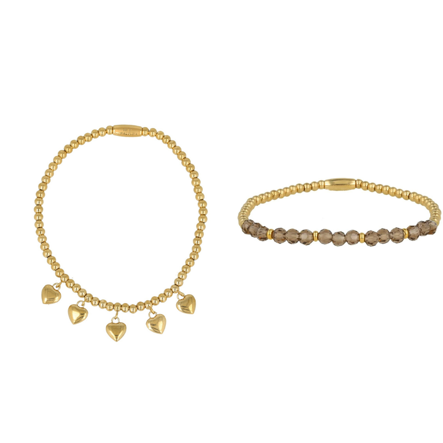My Bendel Elegante set van twee gouden armbanden met stainless steel kralen en lichtgroene glasstenen. Perfect voor elke gelegenheid. # SET217