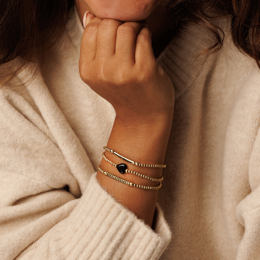 My Bendel Elastisches goldenes Damenarmband mit Anhänger mit schwarzen Zirkoniasteinen