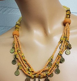 Necklace with orange beads and old coins