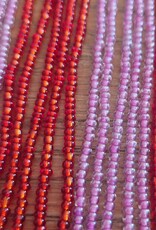 Perlenkette mit Fransen in Rot/rosa mit vielen Perlen