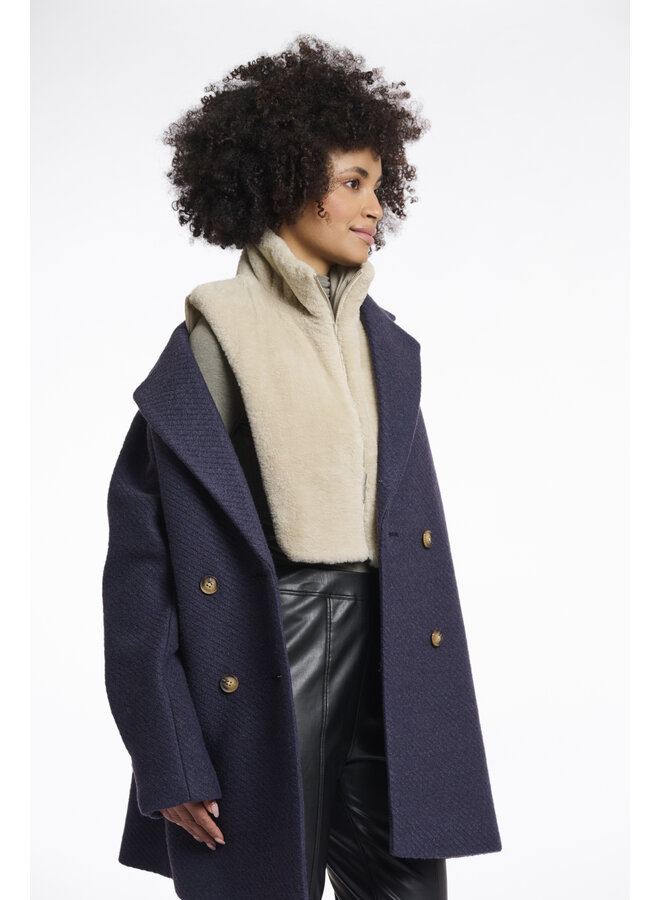 Nura.7002512 Rino en Pelle Reversible bib with faux fur  Birch