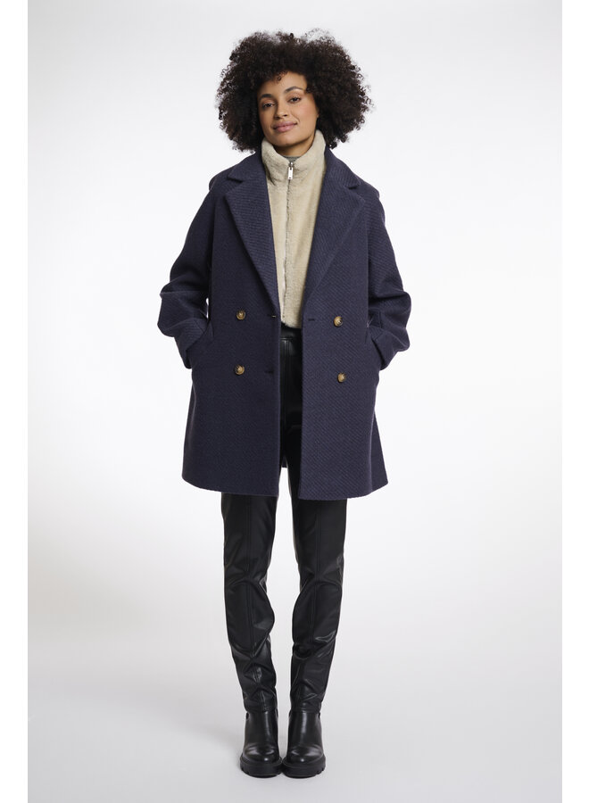 Nura.7002512 Rino en Pelle Reversible bib with faux fur  Birch