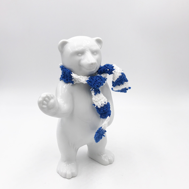 ART-DOMINO® BY SABINE WELZ Porcelain bear from Berlin - With blue and white scarf