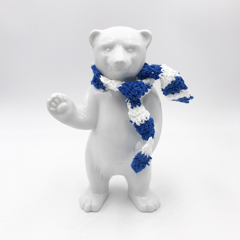 ART-DOMINO® BY SABINE WELZ Porcelain bear from Berlin - With blue and white scarf