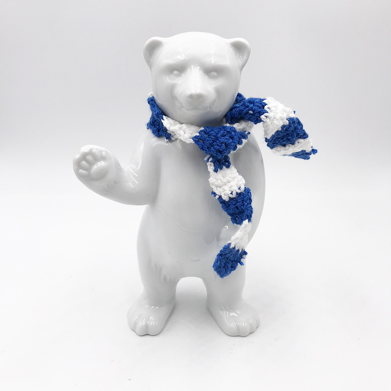 ART-DOMINO® BY SABINE WELZ Porcelain bear from Berlin - With blue and white scarf