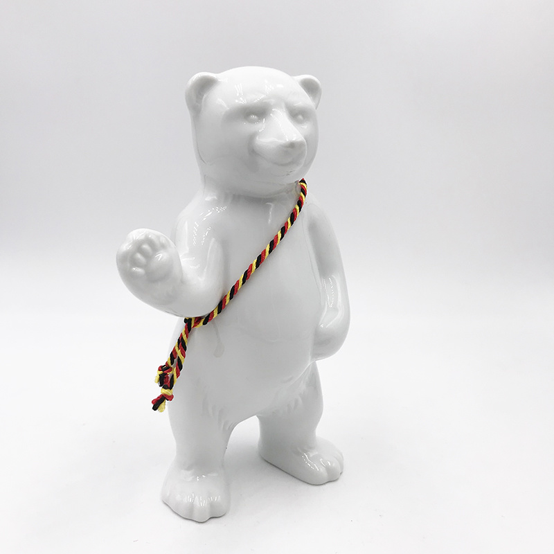 MAGNET-STORIES Porcelain bear from Berlin - With black, red and yellow sash