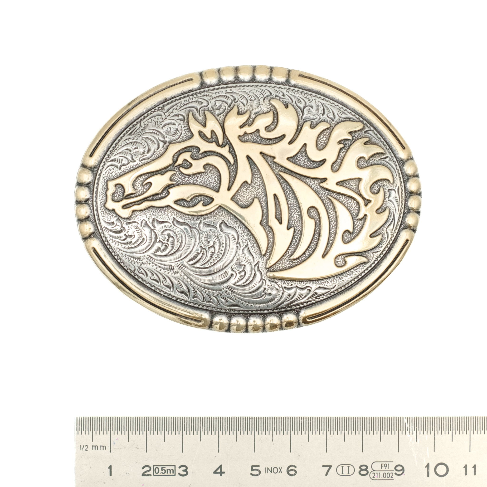 Crumrine Oval metal buckle with gold colored horse head