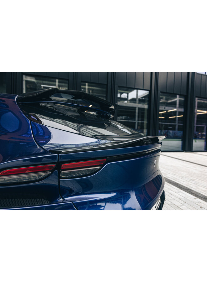 This is a Ferrari Purosangue carbon fiber trunk roof spoiler lip