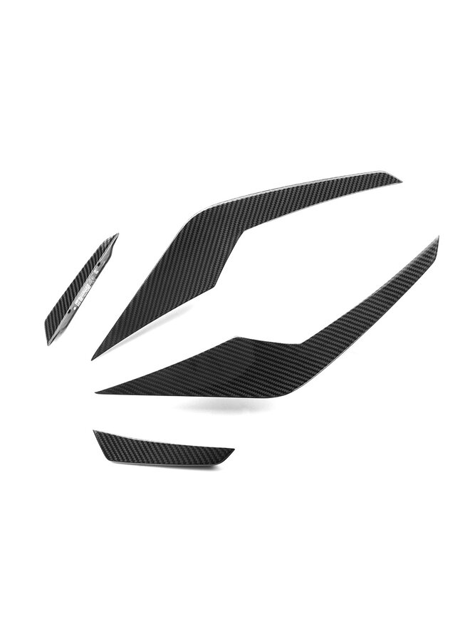 This is a set of BMW G90 G99 M5 SQ Carbon canards front bumper