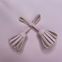 Luiertas met kwastjes (roze) - Uzturre