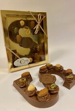 Milk chocolate letter with hazelnut tufts and nuts