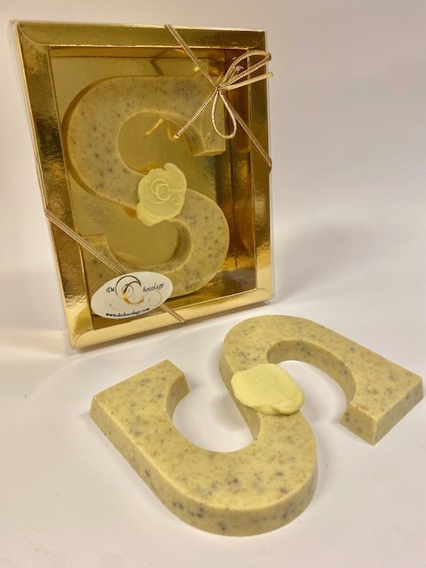 Chocolate letter with cloves and cacao nibs