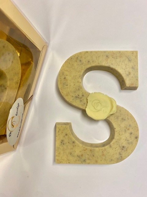 Chocolate letter with cloves and cacao nibs