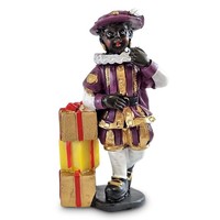 Typisch Hollands Black Pete by a pile of presents