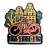 Typisch Hollands Grote magneet Amsterdam - oranje fiets bij gevelhuisjes