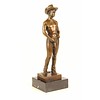 Bronze sculpture of a nude cowboy