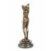 Bronze sculpture of a nude male posing