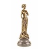 Bronze sculpture of a female in a long dress