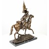 Bronze sculpture of an armed Cossack on horseback