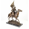 Bronze sculpture of an armed Cossack on horseback