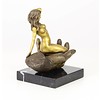 Bronze sculpture of a nude female in a palm of a hand