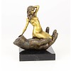 Bronze sculpture of a nude female in a palm of a hand