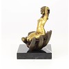 Bronze sculpture of a nude female in a palm of a hand