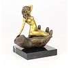 Bronze sculpture of a nude female in a palm of a hand