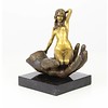 Bronze sculpture of a nude female in a palm of a hand