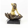 Bronze sculpture of a nude female in a palm of a hand