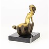 Bronze sculpture of a nude female in a palm of a hand