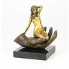 Bronze sculpture of a nude female in a palm of a hand