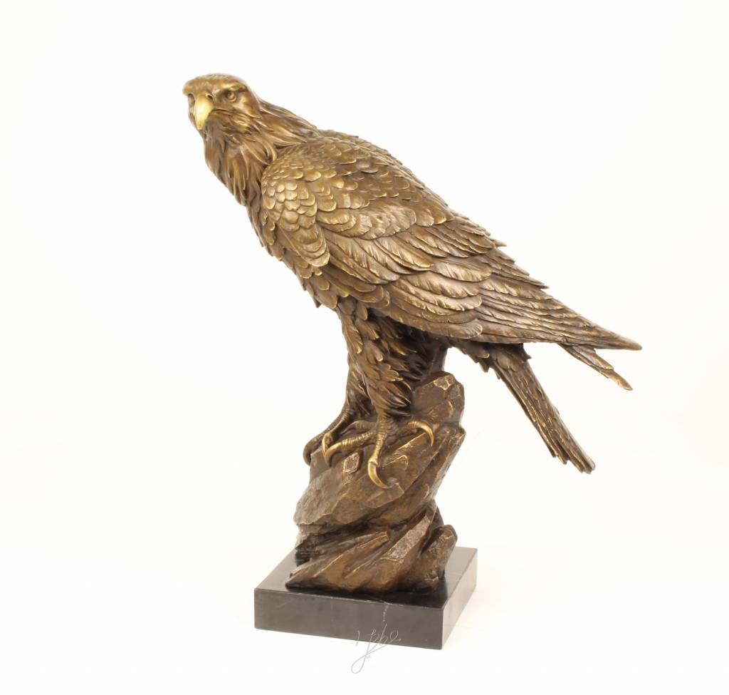 Bronze Sculpture Of A Golden Eagle Sitting On A Rock