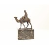 Bronze sculpture of a camel with it's rider