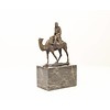 Bronze sculpture of a camel with it's rider